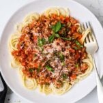 A plate of pasta topped with a healthy turkey bolognese recipe.
