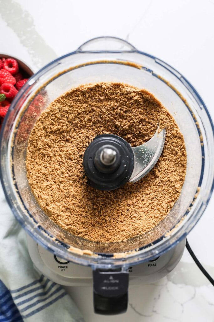 Graham crackers processed into a crumb in a food processor.