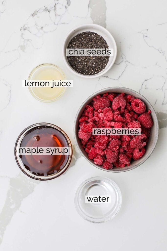 The ingredients needed to make raspberry chia jam.
