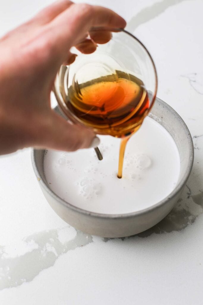 Whisking together the milk mixture.