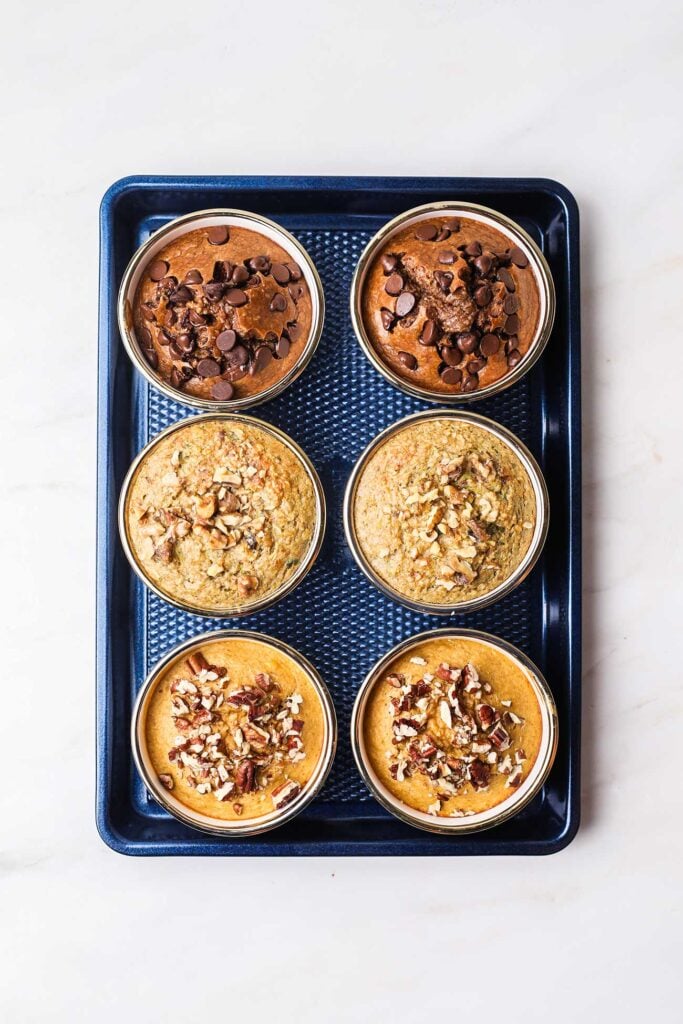 A baking tray showing 3 flavors of healthy baked oatmeal.
