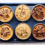 3 flavors of protein baked oatmeal shown on a baking tray.