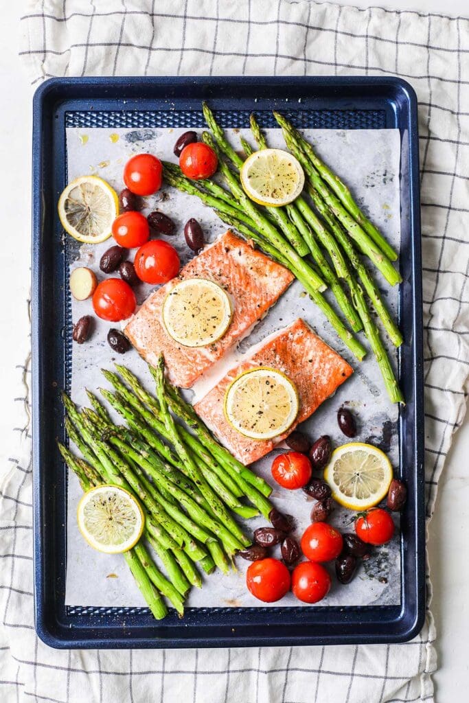 Baked salmon and asparagus on a sheet pan.